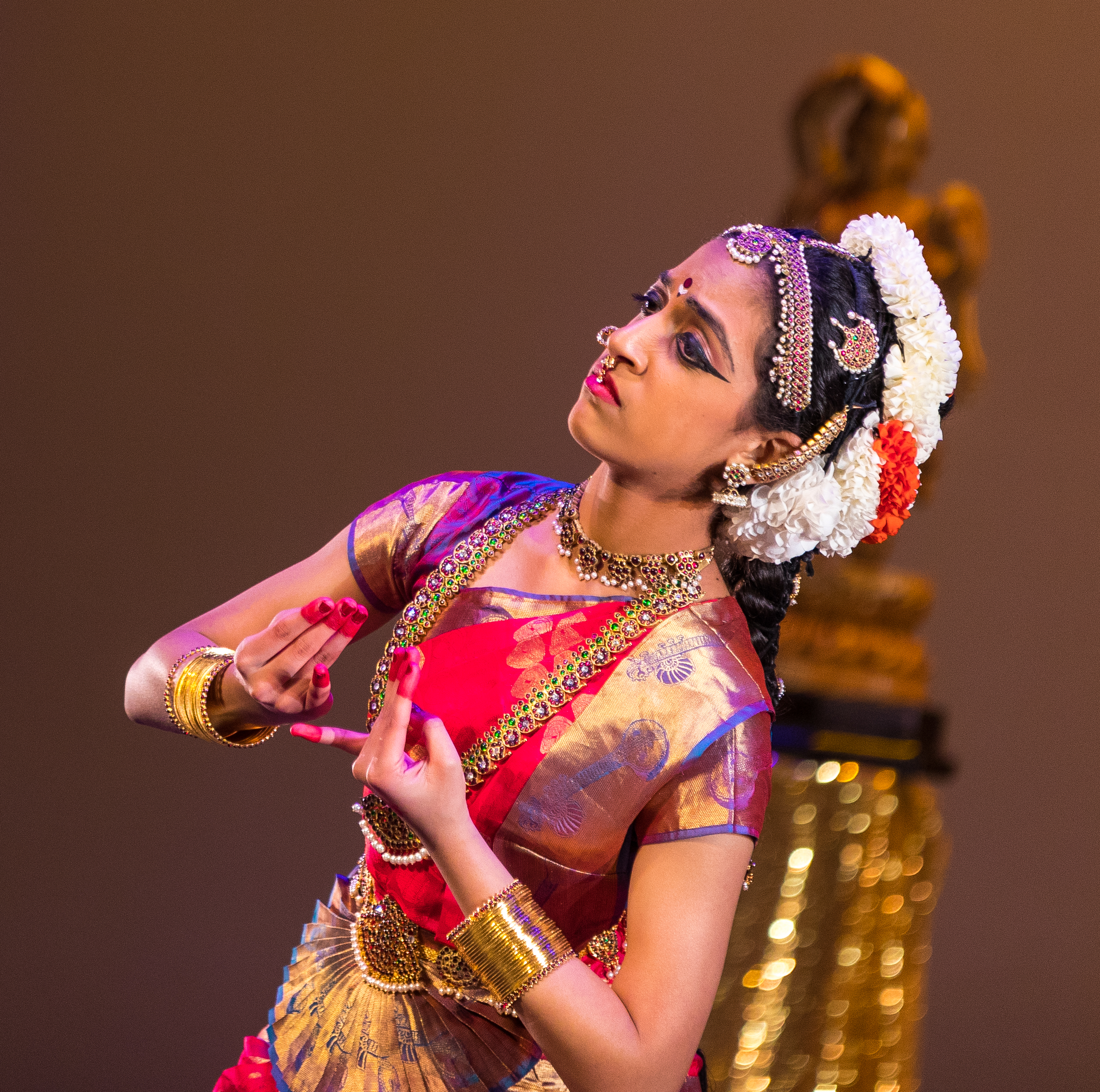 Aarushi Lakhi in a pink and blue Bharatanatyam costume showing pleading