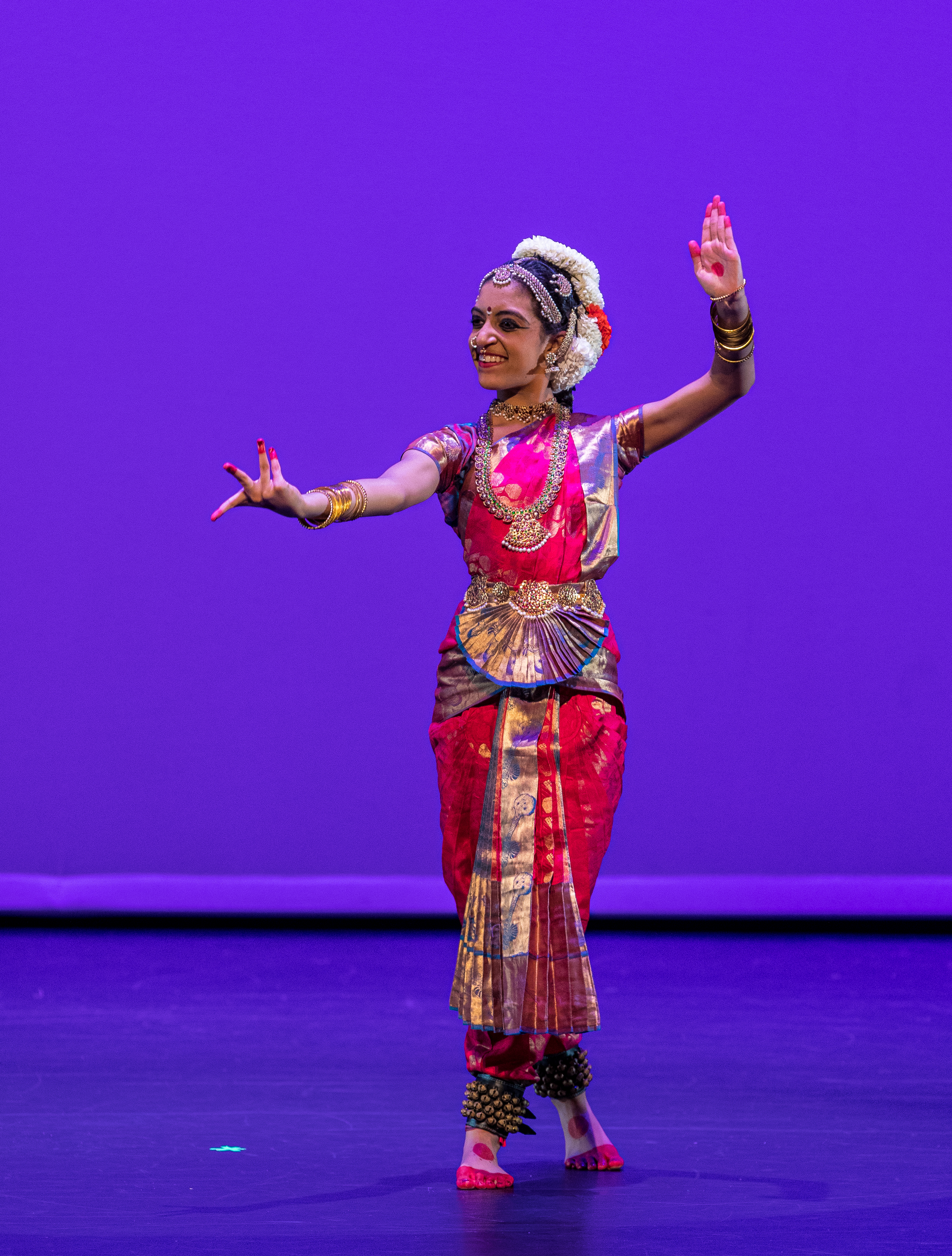 Aarushi Lakhi in a pink and blue Bharatanatyam costume showing blessings